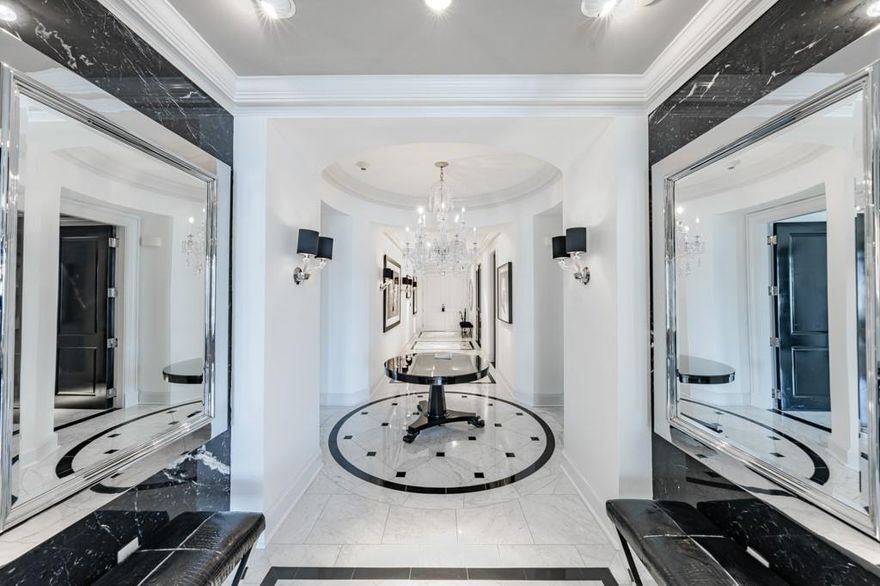 Welcome to the ultimate in luxury living at the ICONIC Ritz-Carlton Residences! This sophisticated sub-penthouse was completely remodeled with designer finishes throughout. This Smart home complete with the prestigious Control 4 System, has operable windows with solar and blackout shade options, 2 gas fireplaces, zoned HVAC, & all marble floors. It boasts stunning city views off of two private balconies. Enter through double doors to the impressive Grand Foyer, perfect for showcasing art. Gorgeous crystal chandeliers in the entry & dining room. The large Library has pocket doors & bellman's closet which could be expanded to make a larger Office or Media Room. 10 foot ceilings with 4-piece crown molding span throughout. The Living-Dining areas feature walls of windows & a corner balcony. The gorgeous Chef's Kitchen features a Carrera marble island, Sub-Zero & Wolf appliances,& ice maker. The Breakfast Nook in the kitchen is complete with a cozy fireplace and breathtaking views . The large Primary Suite boasts city views, a Sitting Area, private 2nd Balcony, enormous custom closet, spa-like Bath with dual vanities & water closets, a jetted garden tub & separate shower. The Guest Suite is split off of the Library and boasts an ensuite marble Bath, and a large walk-in closet. Additionally, a large climate-controlled storage room +3 parking spaces are included. Enjoy resort-style living with 5-star Ritz-Carlton privacy and hotel amenities including Valet, Room Service, Concierge, Pool, Fitness Center & full-service Ritz-Carlton Spa, award-winning Fearing's Restaurant & Rattlesnake Bar, & outdoor Live Oak Bar. Join in complimentary happy hour every evening 6-6:30pm in the hotel lobby.  Located in stylish Uptown near McKinney Avenue, Klyde Warren Park, American Airlines Center, Victory Park, the Arts District, the Crescent Complex, with a walkability score of 93, in a prime location to some of the Dallas' finest restaurants, shopping, entertainment & recreational venues.