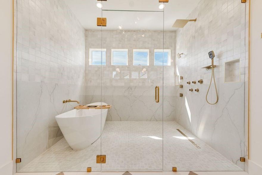 An exquisite modern custom spec home offering refined single-story living on just over one acre. This four-bedroom, four-bath residence showcases an open-concept floor plan crowned by soaring vaulted ceilings throughout, creating a grand yet inviting atmosphere. A stunning bank of windows  floods the home with abundant natural light, seamlessly connecting indoor spaces to the outdoors. The living room is anchored by a striking stone fireplace with gas starter, providing warmth and architectural presence. Designed for both everyday comfort and elevated entertaining, the chef inspired kitchen is expertly equipped with a 60 inch built in refrigerator & luxury appliance suite and is complemented by a highly functional second pantry featuring built-in shelving and generous space for an additional refrigerator. The primary suite is a true private retreat, highlighted by a spa-quality bathroom with an enclosed shower and soaking tub, and a swoon-worthy, naturally lit walk-in closet. Thoughtful details continue with a designated mud area, a separate utility room with sink, and designer-inspired finishes throughout the home. Energy efficient features include a tankless water heater and radiant barrier in the attic. Now Available, this exceptional property offers luxury, functionality, and timeless modern design in a serene setting.