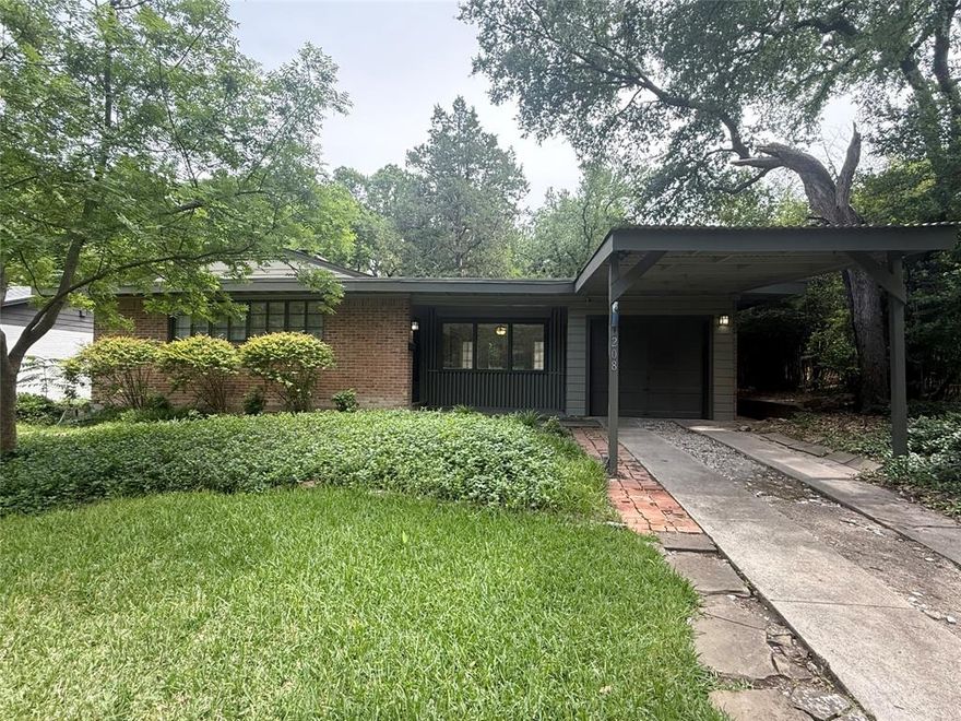 Positioned on an elevated, tree-filled lot overlooking a lush forested setting, 10208 Lake Gardens Drive presents a rare opportunity in one of East Dallas’s most desirable neighborhoods. With expansive views and exceptional topography, this property offers compelling potential as a well-preserved Mid-Century Modern home or a prime homesite for future new construction. The existing residence embraces the defining principles of modernist architecture—clean lines, natural materials, and a seamless connection to nature. Thoughtfully designed to live comfortably beyond its footprint, the light-filled interior features open living spaces ideal for everyday living and relaxed entertaining. A dramatic floor-to-ceiling brick fireplace anchors the main living area, adding warmth, texture, and authentic Mid-Century character. Surrounded by a neighborhood celebrated for its collection of architecturally significant Mid-Century homes, many thoughtfully renovated or reimagined, the area reflects a strong appreciation for timeless design and long-term value. The elevated lot and natural setting create a uniquely private atmosphere rarely found this close to the city. Located just moments from White Rock Lake, residents enjoy walkability to local dining and shopping along with immediate access to miles of scenic trails, sailing, picnic areas, and one of Dallas’s most beloved dog parks. Morning walks beneath the trees, weekends on the lake, and peaceful natural views create a lifestyle that feels both serene and connected. Preserve the existing architecture, renovate to enhance its original character, or envision an entirely new custom home, 10208 Lake Gardens Drive offers a unique opportunity to secure a premier lot and setting in an increasingly sought-after East Dallas location.