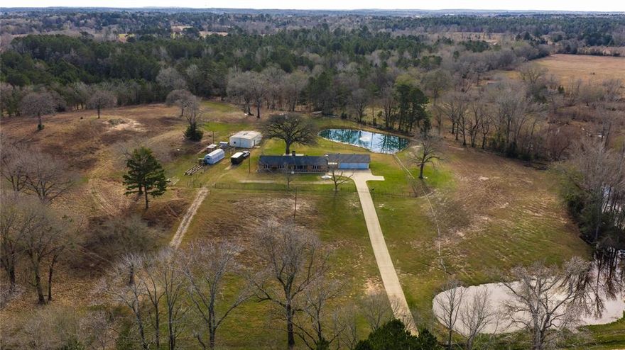 Set on approximately 59.05 scenic acres, this 2,344 square foot home offers the perfect blend of comfort, privacy, and open space. Surrounded by picturesque stocked ponds, this property provides a peaceful country setting.