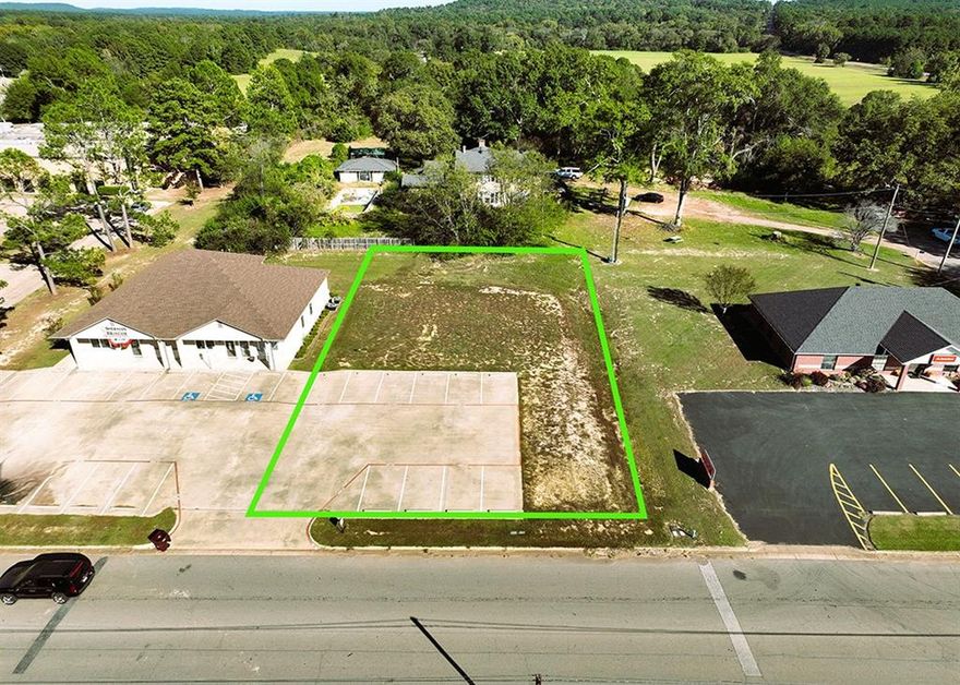 Pad-Ready Commercial Lot in Gilmer, TX

Discover an exceptional opportunity with this pad-ready commercial lot in the heart of Gilmer. Perfect for Medical, Retail, or Office Use, this lot comes fully equipped with concrete paving and 10 designated parking spaces, with room for additional paving to meet your future needs.

The pad site can accommodate a 4,000 to 5,000 square foot building, making it an ideal location for a variety of business ventures. Conveniently located just minutes from US 271 and downtown Gilmer, this site offers high accessibility and visibility in a growing commercial area.

Property Highlights:

Lot Size: Ready for a 4,000 to 5,000 sq. ft. building
Parking: 10 spaces, with room for expansion
Zoning: Suitable for medical, retail, or general business use
Prime Location: Close to US 271 and downtown Gilmer
Utilities: Available and ready for connection
This is a rare chance to secure a prime commercial location that is ready to build on immediately. Don’t miss out on this opportunity to establish your business in a thriving area of Gilmer.