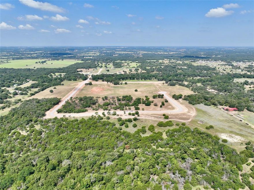 Welcome to The Reserve at Taylor Ranch, Your Private Slice of Parker County Paradise. This lot is fully excavated, turn key, cleared and ready for your build project! Nestled in the quiet countryside of Springtown and within the coveted Weatherford ISD, offering a rare opportunity to own acreage tracts that balance privacy, beauty, and freedom, all just minutes from town. Ranging from hilltop parcels with sweeping views to shaded, wooded retreats;  each one unique and full of potential. With rolling topography that rises nearly 90 feet, the backdrop is breathtaking, offering unforgettable Parker County sunsets and a peaceful rhythm of life that feels miles away from the noise, yet only 20–25 minutes from Weatherford and close to Springtown’s local dining, shopping, & amenities. The Reserve is a true escape, a neighborhood that prioritizes privacy, space, & quality. Build your dream home on your timeline with deed restrictions, no HOA, and the freedom to create a lifestyle that suits you. Enjoy underground electricity, no water bills, well and septic-ready lots, & Next Link Fiber Optic Connectivity, all while being nestled in a quiet community. It’s the kind of place where neighbors wave, stars shine brighter, and the land works with you, not against you. The Reserve at Taylor Ranch isn’t just a place to live, it’s a place to belong. Evenings here feel like stepping back in time, where you can wander under wide Texas skies, catch lightning bugs in the dusk, and enjoy the kind of quiet that lets you hear the breeze through the trees. This is your invitation to slow down, spread out, and savor the simple moments. Come walk the lots, take in the views, and imagine the possibilities. New single-family construction must have a minimum of 1,700 square feet. No Barndominiums.