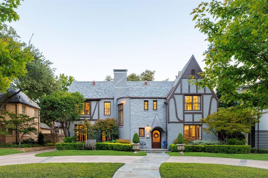 Set on one of the most coveted streets in Highland Park, this timeless 1928 Tudor residence offers a rare blend of preserved architectural character and refined modern living. With 3,876 square feet, 4 bedrooms, 3 full bathrooms, and one half bathroom, the home captures both elegance and comfort in every detail.
Inside, the historic charm is immediately apparent. Original stained-glass windows, detailed crown molding, and thoughtful craftsmanship reflect the artistry of a bygone era, while a new slate roof and copper gutters provide enduring strength and beauty. The interiors balance warmth and sophistication, with inviting living and dining spaces designed for both intimate gatherings and grand entertaining. A dedicated home office provides a private retreat for today’s lifestyle, while the primary suite serves as a serene escape, complete with a beautifully finished walk-in closet.
The outdoor spaces are equally captivating. A lush backyard features a covered patio and custom putting green, creating the perfect setting for relaxation, recreation, and entertaining beneath the shade of mature trees. Complementing the main residence, a detached two-car garage with private living quarters above offers flexibility for guests, extended family, or staff.
Positioned in the heart of Highland Park, this extraordinary property combines enduring character with modern amenities in one of Dallas’ most prestigious locations. From its historic Tudor architecture to its resort-inspired outdoor living, 4309 Beverly Drive represents a rare opportunity to own one of Dallas’ most distinguished homes
