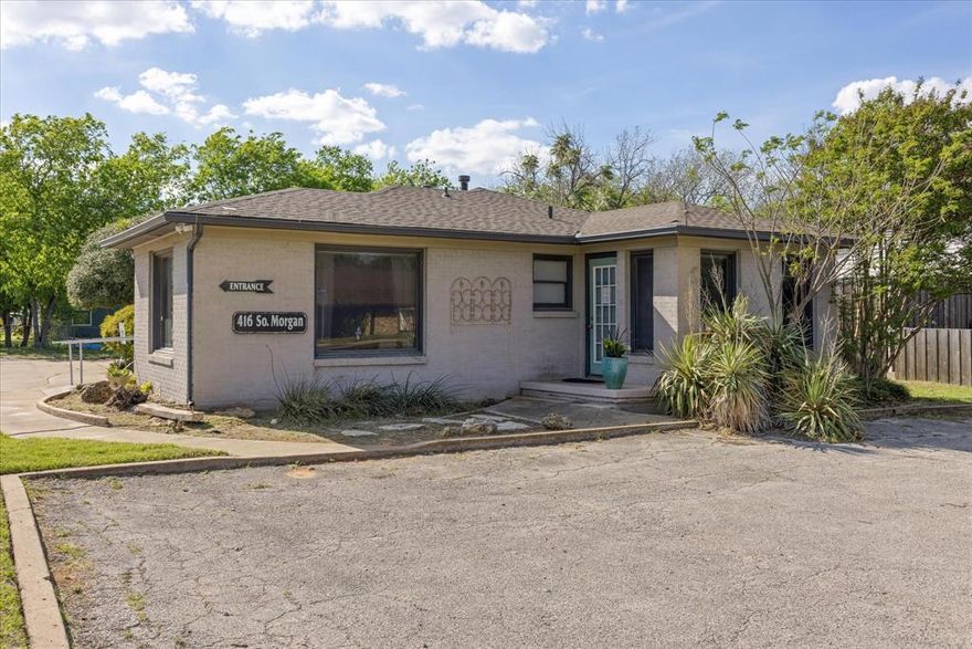 Corner Lot Office Near Hwy 377. Move-In Ready Medical-Professional Space in Granbury.  Ideally located just minutes from the Granbury Square, this well-positioned commercial office property at the corner of Morgan and Elizabeth Streets offers exceptional visibility, accessibility, and functionality in one of Granbury’s most desirable business corridors. Situated on a prominent corner lot, the property is less than 1 minute from Hwy 377 and  approximately 5 minutes from downtown, providing convenient access for clients while maintaining a quieter, professional setting just outside the main traffic flow.  Currently operating as a therapy office, this move-in ready professional office features a flexible layout ideal for medical, counseling, real estate, legal, construction, or general business use. Interior highlights include a welcoming reception area with built-in desk and counter, four private offices, a dedicated sitting room or flex space, and a kitchenette with sink, counter space, and cabinetry. A storage room plus additional storage areas provide excellent operational efficiency.  The property includes a handicap-accessible ramp and railing, supporting ADA-compliant access, along with two separate parking areas for clients and staff.  Located near Lake Granbury Hospital and many other medical offices in a growing healthcare community, this property benefits from strong surrounding demand. This location is close to many Granbury highlights such as High School, close proximity to shopping, dining, and entertainment, along with Granbury’s year-round festivals, events, and tourism appeal. Recognized as one of the Best Historic Small Towns in America for multiple consecutive years, Granbury continues to experience steady growth.  This high-visibility, well-located office is an excellent opportunity for owner-users or investors seeking a versatile commercial asset in a thriving market.