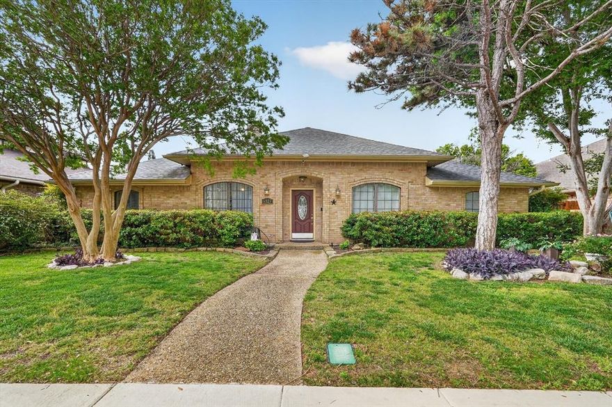 Located in sought after Prestonwood, this beautifully designed single story home offers 4 bedrooms, 3 full baths, a dedicated office, and multiple flexible living spaces that truly adapt to your lifestyle. From the moment you walk in, you are greeted with abundant natural light, vaulted ceilings, and a spacious living room anchored by a wet bar, creating the perfect setting for entertaining or relaxing evenings at home. The thoughtful floor plan includes a private mother in law suite with a full bath just off the fourth bedroom, which also works perfectly as a media room, game room, or flex space depending on your needs. The kitchen flows easily to a secondary side patio, ideal for grilling and outdoor dining. The sun room is filled with natural light and overlooks the pool, offering a peaceful space to unwind while staying connected to the backyard. The primary suite is tucked away for privacy and features generous space and a well appointed bath layout. Step outside to your own backyard retreat complete with a sparkling pool, perfect for Texas summers, plus additional patio space for lounging and entertaining. With its versatile layout, natural light throughout, and seamless indoor outdoor flow, this home checks all the boxes for comfort, functionality, and everyday enjoyment, all with easy access to the Dallas North Tollway, US 75, and nearby shopping, dining, and entertainment.