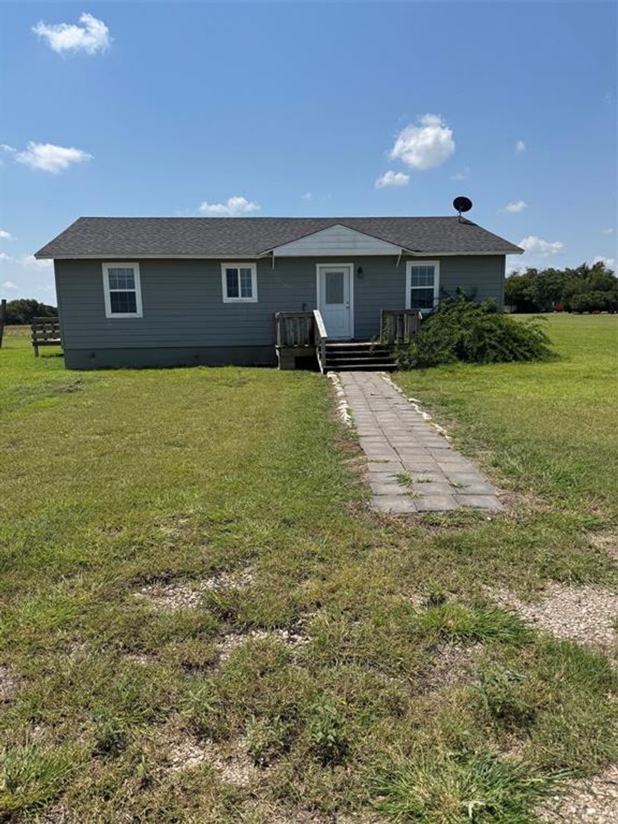 Space, flexibility, and small-town convenience come together on this 1.5-acre property in West, Texas. The 3-bedroom, 1.5-bath home offers a comfortable footprint with plenty of room to grow, plus a versatile portable building that can serve as extra living space, a workshop, studio, or storage. While there’s no garage, the expansive lot provides ample parking and space to add a carport or outbuildings if desired. Enjoy wide-open surroundings close to local schools and all the charm of West, with the added benefit of being situated between Waco and Dallas—ideal for commuters or weekend adventures. Bring your ideas and make the most of this property’s potential.

Highlights:
1.5 acres in the city of West, TX
3 bedrooms, 1.5 baths
Portable building for flexible use
Lots of space, close to schools
Conveniently located between Waco and Dallas
Room to expand or add improvements as needed

Schedule your showing and imagine the possibilities.