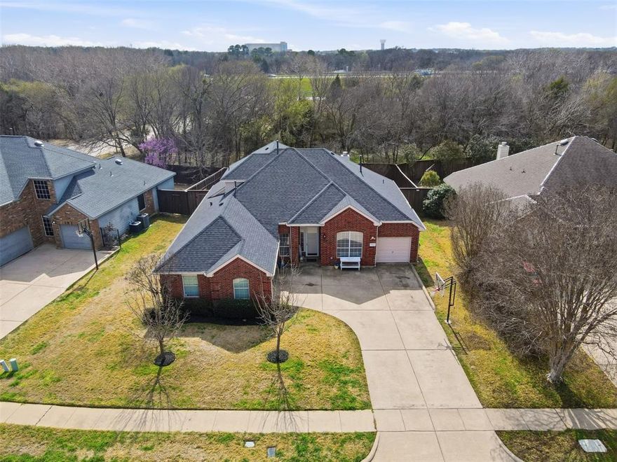 Check out this super cute house with an amazing location! This 4 bedroom, 3 full bath house backs up to the HOA owned greenbelt! Your future back fence even has a gate, so you can walk right out to it. It's close to 287, so you can hop on the freeway and get to wherever you need to go in the Metroplex with relative ease. Walk 5 minutes, or drive 2 minutes to the HOA community pool just down the street. The primary bedroom is on the first floor, but the bedrooms are split, so two are on the other side of the house and one is on the second floor. There's a large open den, breakfast room and kitchen in a flexible open floor plan. A formal dining room, utility room, under stair storage (or reading nook) round out the first floor. On the second is a full bathroom, bedroom and game room. One 2 car garage and a separate single car garage attached make for plenty of covered parking or a place to park the mower, or have a workshop. NEW ROOF in January 2026! Solar screens go with the house as well. Mansfield schools with an easy commute to anywhere in DFW? Can't ask for much more!