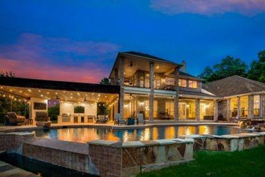 OPEN HOUSE SUNDAY, SEPT 18, 1PM - 3PM!!!  EXTREMELY RARE!!! Imagine pulling into your 10 acre fully gated luxurious custom estate with pastoral creek view that backs up to a golf course on one side and a 400 acre park on the other. Enjoy entertaining in your oversized outdoor kitchen overlooking a sparkling infinity pool with a waterfall and panoramic sunset view over your land. 7,883 sqft covered living space in main home plus an ADDITIONAL 2,600+sqft Barndominium that features separate living, full sized kitchen, bed and bath. Indoor basketball court and classroom, playroom, home office as well. Additional features include: tornado shelter, wine room, massive 2 story attic, surround sound throughout entire home, stocked pond, well for 10 acre sprinkler system, outdoor landscape lighting, 4 separate living areas, playroom, 2 full sized kitchens and one kitchenette. 6 total bedrooms, 5.5 bathrooms. Investment potential for weddings, airbnb, and acreage to build for developers.