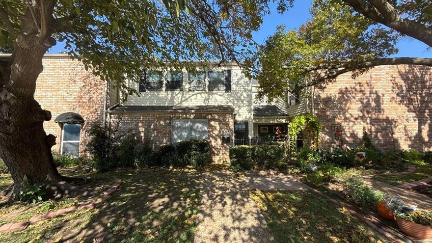 Exceptional opportunity to own this charming two-story townhome nestled in a peaceful community surrounded by parks and walking trails, just 10 minutes from the lake with multiple public boat ramps. This home offers the perfect chance to add your personal finishing touches and make it a forever home. The converted garage provides a spacious game room complete with a convenient half bath. The galley-style kitchen features granite countertops and a tucked-away utility room for added functionality. The first-floor primary suite offers comfort and convenience, while soaring ceilings in the living and dining areas create an open, airy feel and lead seamlessly to a wood deck—ideal for entertaining and connecting to the game room. Upstairs, two generously sized bedrooms share a full bath, and the versatile loft provides flexible space for a home office, nursery, or craft area. Ideally located near shopping and local amenities, this move-in-ready home is perfect for both relaxing and entertaining. Don’t miss this opportunity.