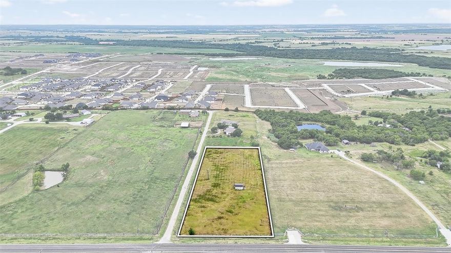 Great opportunity to own 2.1 level acres in a high-visibility location along the path of growth. With no zoning in place, this property is a blank slate ready for your vision—whether commercial, residential, or investment. Positioned along the future Legacy Road corridor, the property offers approximately 210 feet of frontage on FM 455 and is currently accessed via Dusty Lane. A future entrance off FM 455 is possible, enhancing long-term access and usability. The property is fully fenced and already equipped with a water meter and electricity, providing a head start for development.