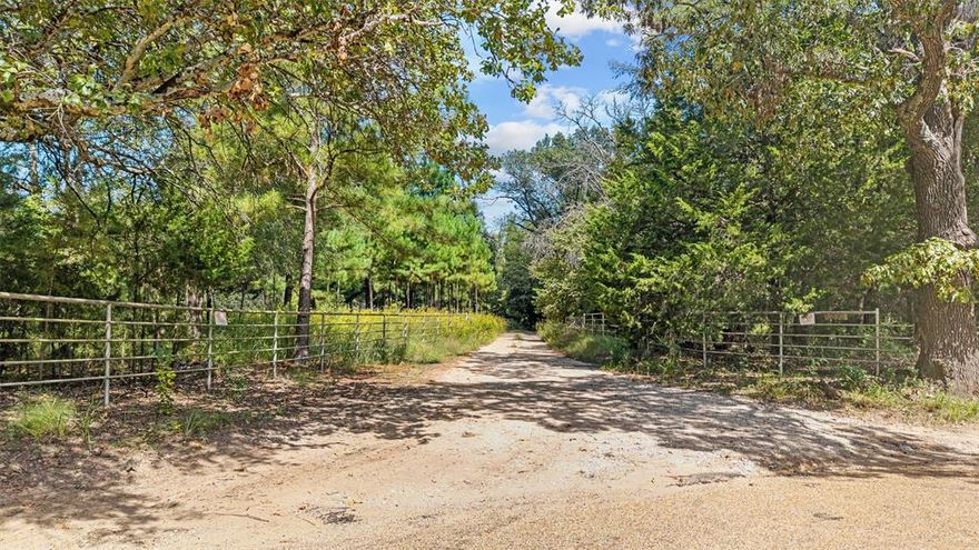 Beautifully treed 59 acres with a handsome pipe fence entry.  The property is situated north of Interstate 20, south of highway 80, just east of Canton and a short drive from Dallas.  The property is currently being used for hunting deer and hogs.  The hunting blinds convey.  The property includes two small ponds.  Residential development just south, across the street.