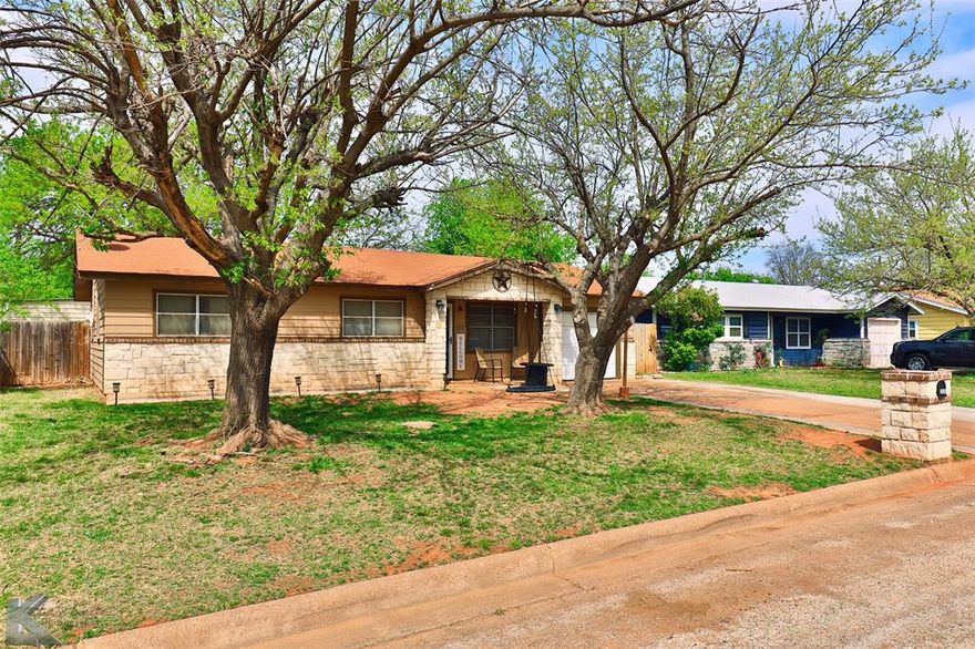 Located in the heart of Abilene, this updated charmer is a must see!  The front porch welcomes you home with plenty of space to enjoy that morning coffee.  Entering the front door and seeing the living room, you will know instantly that this home was meant for you.  Updates throughout the house give this home so much character.  The kitchen, which opens up to the dining area, has the perfect amount of space and storage with an abundance of natural light. All three bedrooms have plenty of space.  The patio in the backyard is the perfect place to finish the day grilling out or just enjoying the large trees. You will also like the laundry room, the 15x15 shed in the back and the one car attached garage along with the expanded driveway out front for ample parking. Some additional updates include ceramic wood look tile, 2 year old kitchen appliances, updated electrical panel, and a nice double gate in the backyard. Make a point to see this house fast before it is gone.