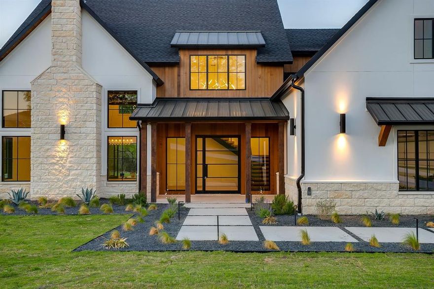 Experience luxury living at its finest in this meticulously crafted custom home where no detail has been overlooked. Located in Bear Creek Estates within the highly sought after Aledo ISD, this home is built with pride and precision, showcasing exceptional quality and timeless design in every detail. Enter through custom steel pivot doors onto beautiful White Oak engineered wood floors that flow seamlessly through an open-concept floor plan accented by rich wood beam details throughout. The gourmet kitchen is a true showpiece, complete with quartz countertops, a Viking appliance package including a built-in refrigerator, and a spacious butler’s pantry for effortless organization and entertaining. The living room exudes warmth and sophistication, highlighted by a real wood beams and a stunning Austin White Stone fireplace that serves as the perfect focal point for gatherings. Expansive sliding glass doors open to a large covered patio with a fully equipped outdoor kitchen, extending your living space into the serene outdoors. Each bedroom is generously sized and features custom closets, offering both style and practicality. Modern efficiency meets elegance with three tankless water heaters and spray foam insulation for year-round comfort. Set on a large, private lot backing to Bear Creek, this property offers a tranquil setting with scenic views and serene privacy, an ideal retreat from the everyday. From the finishes to the fixtures, every element has been intentionally chosen, making this home a true reflection of craftsmanship and care.