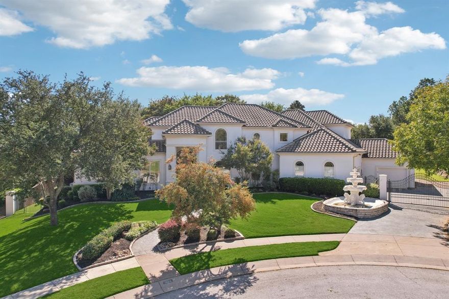 Tucked away on a quiet cul-de-sac in the coveted Coventry Manor community of Southlake, 1403 Lands End Court offers refined living on over half an acre. This beautifully updated 5,188 sq ft residence features 5 bedrooms, 4 full baths, and 1 half bath, with a well-designed layout ideal for both everyday comfort and entertaining. Soaring ceilings, abundant natural light, rich wood floors, and three fireplaces create warmth and elegance throughout multiple living and dining spaces. The gourmet kitchen shines with granite countertops, a large island, gas cooktop, double ovens, built-in refrigerator, walk-in pantry, and generous cabinetry, opening seamlessly to the inviting family room. The first floor also includes a private office with built-ins and a spacious primary suite with sitting area, dual vanities, separate shower, and walk-in closets. Upstairs offers a versatile retreat with a large game room, dedicated media room, and three additional bedrooms, many with ensuite baths. Outside, enjoy a private backyard oasis featuring a sparkling pool, covered patio, mature trees, and expansive grassy yard. Additional highlights include a 3-car side-entry garage with epoxy flooring and electric gate and basketball hoop, home has a tile roof and stucco exterior. Located in award-winning Carroll ISD and minutes from Southlake Town Square, parks, library and Highway 114, this home delivers the best Southlake lifestyle.