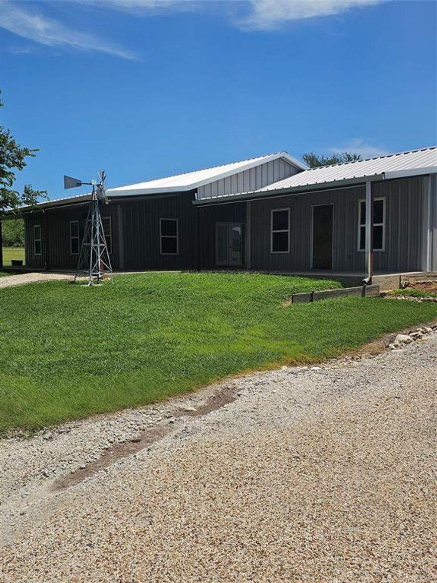 Charming Metal Home with Guest Suite, Shop & Energy-Efficient Features Near Lake Whitney

Don't miss this unique and well-maintained all metal home on nearly an acre in a quiet subdivision just minutes from Lake Whitney!

The main home features 1 bedroom, 1 bathroom, and a spacious open concept living room and kitchen with high ceilings and great natural light. A covered breezeway connects to the guest house, which includes a combined bedroom living area, full bath, and laundry room perfect for guests, in laws, or rental potential.

Enjoy the convenience of a 24x24 detached shop, fully insulated and ready for projects, storage, or hobbies.
shop has an attached 24x24 covered carport.

Additional highlights:

Full spray foam insulation in all buildings
All 2x6 framing.

2 HVAC units for efficient climate control

Tankless propane water heater

Quiet, well-kept neighborhood with no through-traffic

Plenty of room to expand or garden

Perfect for full-time living, weekend getaways, or investment. Schedule a showing today and see the potential!