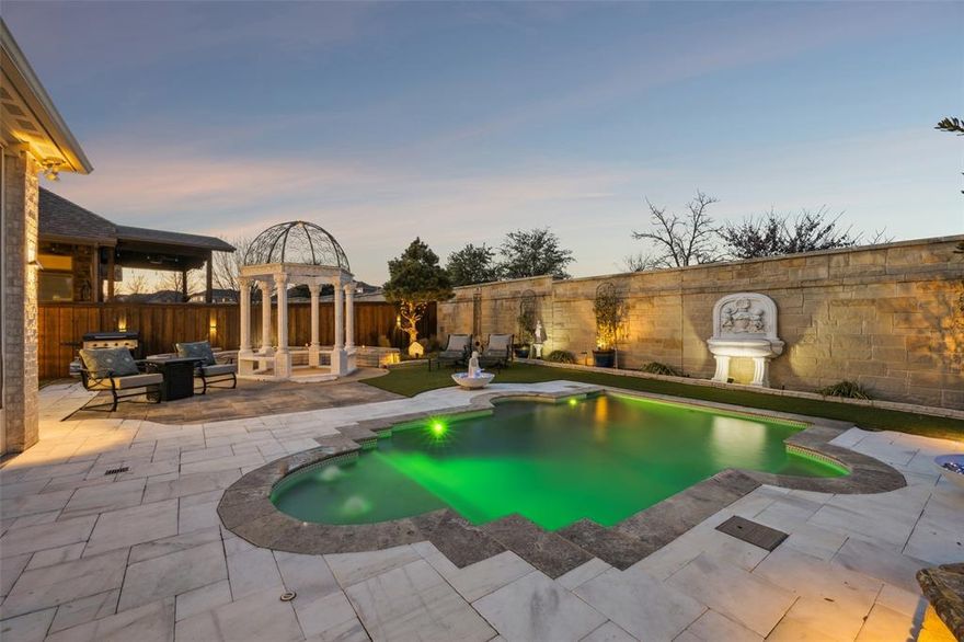 Spring flowers and summer gatherings are rolling in and so is the joy of splashing in your own refreshing plunge pool at 405 Green Valley. You must experience this Trinity Falls stunner in person. Built by top ranked Highland Homes, this polished single story delivers turnkey value with elevated finishes including plantation shutters throughout, designer lighting, 12 foot ceilings in the living kitchen and breakfast spaces, 8 foot doors, granite counters, a chef ready kitchen with oversized island, walk in pantry, 5 burner gas cooktop, upgraded appliances and Bosch dishwasher. A dedicated drinks and wine room adds boutique function with custom built ins and serving space for gatherings. A serene light filled meditation and wellness room overlooks the backyard for morning calm, reading or creative reset. The primary suite is a true retreat with a soaring cathedral ceiling, spa style bath with deep garden soaking tub, split vanities, and built ins in the primary closet. No carpet throughout for easy care living, plus oversized laundry and custom Gladiator garage storage. Outdoors enjoy eco turf for no mow ease, phone control for pool lighting and HVAC, and self monitoring pool equipment for peace of mind. Trinity Falls is a 2000 acre master planned community with two community pools, two clubhouses, fitness center, dog park, splash pads, playgrounds, disc golf, catch and release fishing ponds, winding trails, an outdoor amphitheater and a full calendar of community events, plus Frazier Elementary inside the neighborhood, minutes to the new HEB and easy access to Hwys 75 and 121.