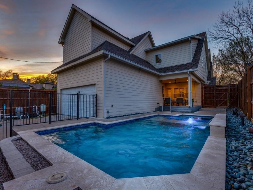 Effectively new as of 2018, this 5-bedroom home offers like-new construction in the heart of the M-Streets, just steps from Tietze Park and minutes to Greenville Avenue. Light-filled interiors feature hardwood floors, custom built-ins, and an open-concept layout ideal for everyday living and entertaining. The kitchen is anchored with a large island and is equipped with quartz countertops, stainless top of the line appliances, gas range, and butler’s pantry. Main level features a private office with French doors, guest bedroom with full en-suite bath, and a dining area with sitting nook overlooking the front yard. Upstairs offers a secondary living area or game room plus a versatile storage or playroom. Mudroom and spacious utility room add everyday convenience. The primary suite features a spa-like bath with dual vanities, soaking tub, and glass-enclosed shower. Secondary bedrooms are well-sized with updated baths. Backyard oasis retreat completed in 2022 includes a pool, spa, and covered patio with fireplace and Sonos sound system. Spray foam insulation and solid core doors enhance comfort and efficiency. Walkable to dining, parks, and trails with easy access to US-75.