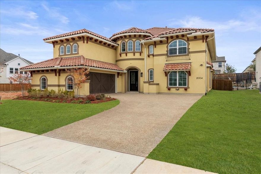 Experience refined sophistication in this meticulously crafted modern Mediterranean residence with architectural elegance by Grand Homes; located in the heart of Frisco. Completed in 2024 and never-lived-in, this expansive 4,800 sq. ft. custom-built residence blends timeless taste with modern innovation and exceptional energy efficiency. From the moment you enter, you’re greeted by exquisite marble flooring, soaring ceilings, abundant natural light, and a dramatic dual staircase that truly sets a grand tone. A robust 1,000-pound residential elevator enhances the home’s effortless flow, providing seamless access to every level with unmatched convenience. The gourmet kitchen is a chef’s dream, showcasing KitchenAid commercial-grade appliances, a 6-burner gas range, an oversized island, sleek 42-inch cabinetry, a spacious walk-in pantry, and an adjacent wet bar; perfect for both intimate gatherings and large-scale entertaining. The main level also features a versatile mother-in-law suite or private executive office. Upstairs, discover 4 generously sized bedrooms, a large game room with a second wet bar, an additional living area, and impressive storage throughout. Intentional custom touches continue with a central vacuum system and a sprawling 350 sq. ft. extended patio running the full width of the home; ideal for outdoor living.
Just minutes from premier destinations including The Star, PGA Headquarters, and the highly anticipated Universal Kids' Resort, this residence offers unparalleled access to Frisco’s finest amenities. Zoned to highly acclaimed Frisco ISD schools, this home delivers exceptional luxury, lifestyle, and convenience in one extraordinary package.