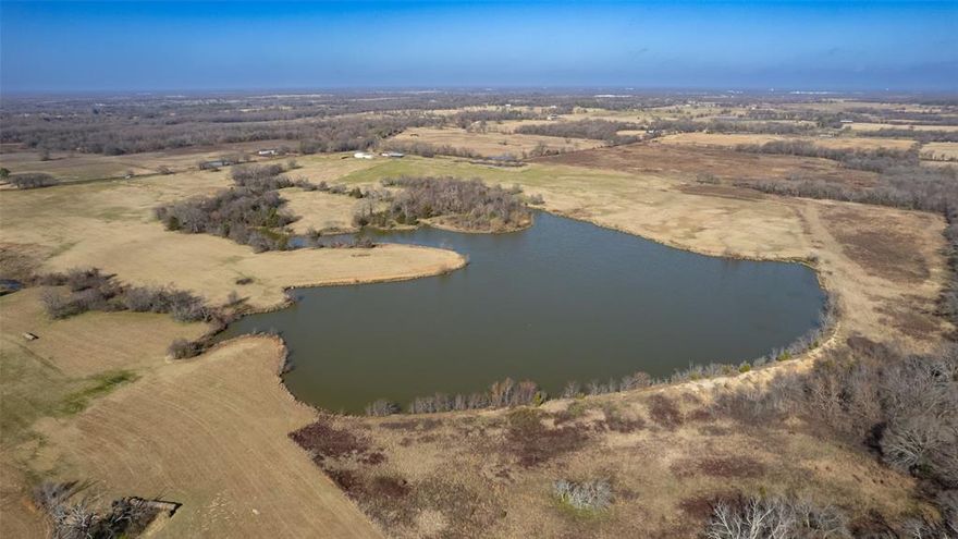 This picturesque 212 acres with AG-exemption comes with a rare 17-acre private lake that sits on sandy soil! Once you see the gently rolling terrain, you will understand why this has always been one of the most sought-after areas of the county.  Quiet country living found less than 6 miles south of Sulphur Springs makes this a great spot to build or develop. Lots of road frontage gives you multiple places for access. Improved pastures provide good grasses for livestock. The wooded areas make for an ideal, private building site for your new home. Property has 2 water meters, 1 well (at the old dairy site), fencing and cross-fencing, and an AG-Exemption. Seven additional ponds provide plenty of watering holes for cattle. For storage of equipment or hay, choose from one of the 3 barns. Whether you keep this for yourself or hold onto it as a future investment, this property offers lots of possibilities.