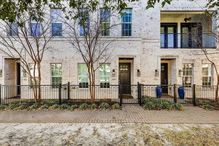 Modern 3-level brick townhome in a prime Dallas location with direct access to White Rock Creek Trail and White Rock Lake—no car required. This 2-bedroom, 2.1-bath home offers 1,350 sq ft of stylish living with hardwood floors throughout, a primary suite with board-and-batten accent wall and crown molding, and a beautifully appointed Bosch kitchen featuring quartz counters, gas cooktop, full appliance suite, and subway tile backsplash. Built in 2019, this home also includes a dual heat pump HVAC system and tankless water heater for ultra-low utility costs.  Enjoy the convenience of an attached 2-car tandem garage with direct entry, plus HOA-covered cable, internet, water, trash, recycling, and landscaping. A rare combination of modern efficiency, low-maintenance living, and unbeatable trail access.