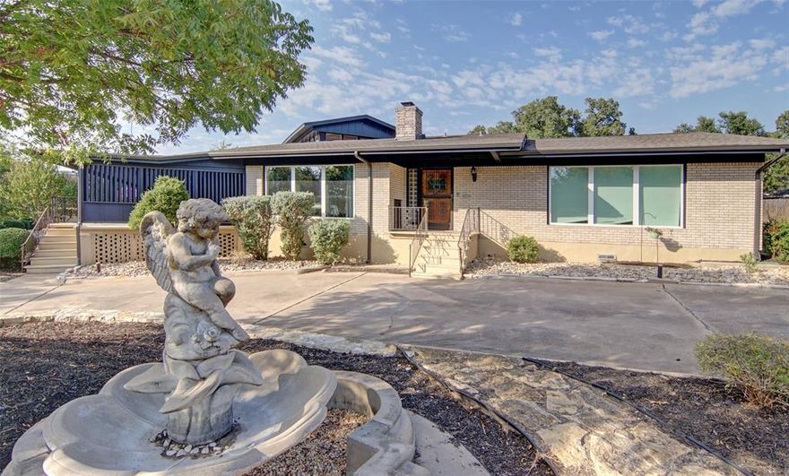 Exceptional & Versatile Home in the Heart of Mineral Wells! Step inside to an inviting living area centered around a one-of-a-kind fireplace, complemented by a wall of windows that flood the space with natural light. The chef’s kitchen is a true highlight, featuring a Subzero refrigerator, two gas ovens, a central island with an electric cooktop, & seating. Sliding doors open to an expansive covered patio—perfect for entertaining. Designed with flexibility in mind, the floor plan is ideal for multi-generational living or hosting guests. All four bedrooms are located on the main level, including a private suite with its own sitting area & exterior entrance, as well as another bedroom with an ensuite bath. Upstairs, a charming turret-style room offers a versatile space for a home office, game room, or even a private stargazing retreat, with breathtaking views framed by walls of windows. The home also features a well-appointed utility room with garage access, a walk-in pantry, space for a freezer, washer & dryer hookups, & a half bath. Just five minutes from the historic Baker Hotel, this remarkable home offers a unique blend of charm, functionality, & accessibility. Recently redesigned with plans for an assisted living center, the home includes thoughtful features such as wider doorways, bathroom handrails, access ramps from the backyard and garage, a full fire alarm & sprinkler system, and a secure safe room—enhancing both comfort & safety. Outside, the property is equally impressive. A long driveway welcomes you with a lush green space at the entrance, leading to an RV carport & drive-through garage that connects to a wraparound driveway. The fully enclosed backyard provides multiple seating areas & a separate fenced section, ideal for storage, pets, or additional customization. Perched on an elevated street, this home offers picturesque views of a serene, wooded greenspace, creating the perfect balance of privacy & convenience in the vibrant & growing MW community!