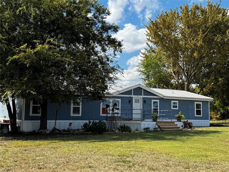Welcome to your peaceful country retreat in Rhome, Texas! Situated on just under 3 acres, this inviting property offers the perfect balance of open space and comfort. The land is fully fenced with barbed wire and features a seasonal creek lined with mature trees along the south side, adding natural beauty and privacy.
The spacious 4-bedroom home provides room for everyone, with plenty of natural light and a warm country feel. A few mature shade trees surround the home, offering a welcoming touch and outdoor relaxation spots.
The property also includes a workshop with a garage door, ideal for hobbies, projects, or use as a man cave or additional garage space. A covered area attached to the workshop provides extra room for equipment, outdoor entertaining, or storage.
Bring your animals — horses and chickens are welcome! A chicken coop is already in place, ready for your own farm-fresh eggs. This property truly captures the charm of country living with the convenience of nearby amenities.
Located in the highly regarded Decatur ISD, this home offers an easy commute to Rhome, Decatur, and Fort Worth via Highway 287 and 114. Enjoy weekends exploring Lake Bridgeport, just a short drive away — perfect for boating, fishing, and lakeside picnics. Nearby attractions also include Eagle Mountain Lake, downtown Decatur’s charming courthouse square, and the Rhome Veterans Memorial Park.
If you’ve been dreaming of a property with wide-open views, room to roam, and country comfort, this is the one. Come experience the peaceful lifestyle of Wise County — where sunsets are big, stars are bright, and every day feels a little more relaxed.