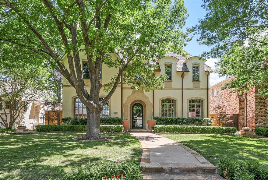 Welcome home to 2809 Stanford Avenue! This University Park gem has been completely renovated and updated by Robert Elliott Custom Homes and designed by A Well Dressed Home spans 5,489 SF on a 60x140 lot. The house features 5 beds, 5.2 baths, and 3 living areas. The main level boasts a thoughtfully designed floor plan, with a wet bar and wine closet and 2 powder baths convenient for guests. The light and bright gourmet kitchen, adorned with quartz countertops, 2 pantries, Wolf gas range and Subzero fridge, is a chefs dream. Head outdoors to discover a pool and outdoor living area complete with a fireplace and newer grill.  With an office, 3 cozy fireplaces, a dog run, and an epoxy-floored 2-car garage, this home offers elegance and functionality. The master suite is complete with a oversized shower, soaking tub, and his-and-hers closets and dual vanities. Additional highlights include a playroom overlooking the backyard and a third-floor fifth bedroom with a full bath.