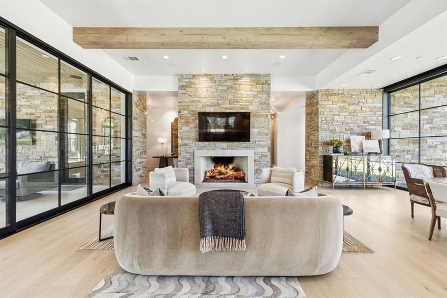 Welcome Home to this Stunning Contemporary Masterpiece in Westlake's prestigious Quail Hollow. Built in 2022 by Cary Hy Custom Homes & designed by SHM Architects & G. Bradley Alford Designs, this modern, luxurious home boasts open-concept living with an abundance of glass-metal windows showcasing the beautiful front grounds and gorgeous backyard. Highest end Designer finishes are throughout. Enter to a gorgeous welcoming Foyer to then step into the Great room with tons of natural light and walls of glass. Chef’s Dream Kitchen with Dacor appliances, 2 dishwashers, warm & steam oven + built-in seating banquette. The Owner’s Retreat boasts beautiful backyard views, a private Den, plus a resort style Spa Bath with heated floors, steam shower, coffee bar, luxury tile & wallpaper, plus 2 walk-in closets. A Private Guest Suite with separate entrance is also down. All 3 upstairs Bedrooms boasts en-suite Bathrooms and walk-in Closets. The Game-Media room has a dedicated sound system + blackout shades. Home features include Lutron Control 4 system, Elevator, Safe Room & Generator. Expansive outdoor space includes covered patio with electrics shades, gas grill, landscaped & turf yard, mature trees, ambient lighting, fire pit & heated pool with stunning water features and retractable pool cover.