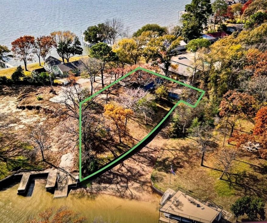 ** POSSIBLE OWNER FINANCING ** HALF ACRE! Survey done. RARE, private WIDE lot at end of no-outlet culdesac street. 200 feet of shoreline. ROOM TO BUILD a second home. FISH FROM YOUR YARD!! The best of both worlds on a quiet channel, with open views of the water at the front and side. At both the MOUTH and the END of a quiet channel, this home has open water views from the front, side and back, plus EXCELLENT FISHING from the banks in your yard. Channel gets full when lake is up. This batten-and-board cedar cottage is fully-furnished, with a STEEL RETAINING WALL. Originally had a boat house. Remodeled from top to bottom within the last year. One of the original cabins on the lake, built 1965, this is the kind of home that typically gets handed down through the generations and doesn't come to market. This is a RARE location next to the end of a point, and a no-outlet street, surrounded by million dollar homes, in the enclave of Eastwood Island, with a private property-owner's park, boat launch, fishing piers and pavilion. Gorgeous Cedar Falls roof, Tempest Blue quartzite countertops, luxury vinyl plank floors, premium Sherwin-Williams stain on the exterior cedar, premium interior paints, and more top-of-the-line features. Updated electrical and plumbing, big SHE-shed or man-cave, finished out with electrical. Included furnishings are dining room set, bedroom sets, washer & dryer, all other furniture and appliances. Lots of ducks and great blue herons swimming by, an AMAZING view of the wide open water at the front of the home and from the windows. EVERY WINDOW IN THE HOUSE has a view of the water except one.Designed by an architect from Dallas, you can see the mid-century modern touches. Used to have a boathouse.  Don't miss out on this incredible opportunity! Eastwood Island has 210 homes, one way in and out. EXCELLENT SHORT TERM RENTAL. Lake pump. Room for swimming pool. Private POA park,boat launch,fishing piers. Owner is licensed real estate broker in Texas.