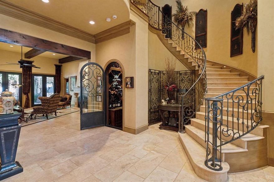 Step into this extraordinary home

A grand stone staircase with wrought iron railing welcomes you, set against floors of Turkish travertine. Exposed firewood beams painstakingly stained to perfection. The quality is so extraordinary that two cranes broke during installation.

Throughout the home, hand-scraped oak floors, multiple marble fireplaces crowned with elegant molding, and plantation shutters elevate every space.

The living room boasts gorgeous iron French doors that open to a sprawling outdoor patio, seamlessly blending indoor and outdoor living.

The oversized kitchen is a chef’s dream, featuring a massive granite island with oval seating for six, custom maple cabinetry, and top-of-the-line appliances.

For entertainment, enjoy a massive media room complete with billiards, home theatre, and a commercial-grade pub with stainless steel finishes.

The library-sized study is wrapped in rich maple wood paneling, with soaring ceilings, plantation shutters, and semi-circular windows that flood the room with natural light.

Stay fit in the exercise room, equipped with 4,500 lbs of professional-grade equipment.

Wine enthusiasts will love the climate controlled wine cellar, capable of holding 3,000 bottles.

The primary suite is a retreat in itself with a custom iron chandelier, breathtaking backyard views, and a spa like bathroom featuring diamond pattern granite floors, double sinks, an oversized shower with three body sprays, plus a urinal and bidet. The master closet boasts a soaring ceiling and a hidden passageway leading to the library.

Step outside to your resort-style patio, with an in-ground spa, towering 15-foot privacy fence, built-in grill, outdoor fireplace, oversized TV, double ceiling fans, and dining area — all watched over by two majestic custom stone lions.

This home is truly one-of-a-kind, offering a blend of artistry, function, and luxury that must be seen to be believed.
