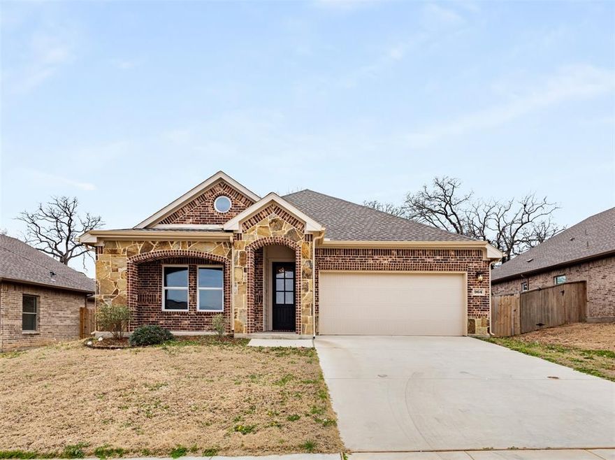 CUSTOM BUILT NEW HOME located just minutes to Hwy 199 and downtown Springtown. Enjoy the quiet rural subdivision life with NO HOA that this home has to offer with towering Oaks and just around the corner to a beautiful park perfect for evening walks. This gorgeous home has great curb appeal with a brick and stone front and covered front porch. Inside, find a neutral light color palette with 4 Bedrooms, 2 Baths and 2 Car Garage. The upgraded custom kitchen with bonus upper glass paneled cabinets is a masterpiece with complementary granite counters, walk in pantry and large island. Primary suite with spacious bedroom and en-suite bath featuring separate shower and tub shower combo, dual sinks, ample storage space, and large walk in closet. The backyard is amazing and peaceful with huge oak trees proving shade and a nice covered patio. Full landscaping and irrigation! Beautiful Crown Molding details in all main spaces! FULLY ENCAPSULATED FOAM INSULATION for supreme energy savings! Lower tax rate at 2.06% makes this a perfect place to call home! 3D Tour located in Virtual Tour Link! Check it out!!