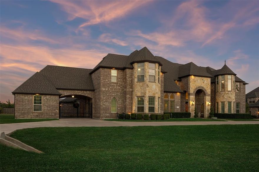 No sign in the yard. If this is active, still for sale. Nestled on over an acre of beautifully landscaped grounds, this dream estate captivates from the moment you arrive. The striking exterior evokes the grandeur of a castle, featuring an elegant brick & stone façade, a sweeping circular drive, lush gardens & a stately porte-cochere that set the tone for what awaits inside. Step through the grand entryway to be greeted by soaring ceilings & a show-stopping double staircase that makes an unforgettable first impression. Wall-mounted sconces, art niches & a dazzling chandelier create an atmosphere of refined sophistication. Formal dining room, perfectly proportioned for elegant dinner parties + a formal living area, where custom built-in bookcases + a wall of windows frame sweeping views of the resort-style backyard. A private study w-plantation shutters offers the perfect retreat for working at home. The main living room is both inviting & impressive w-hand-scraped HW floors, a cozy gas fireplace & seamless flow into the Chef’s Kitchen. Designed to inspire, the kitchen features an oversized island illuminated by double pendant chandeliers, granite countertops, tumbled-stone backsplash & premium appliances, including a built-in refrigerator, double sinks + a gas cooktop with a designer vent hood. The primary suite is a true sanctuary. Spacious enough for a full sitting area, it boasts tiered ceilings & a spa-inspired ensuite bath featuring dual vanities, a luxurious garden tub, an oversized double shower + a massive WIC. Upstairs, the entertainment options are endless. Host game nights in the impressive game room complete with a wet bar, or enjoy movie nights in the dedicated media room. Each guest bedroom offers generous space and comfort. The enclosed patio with glass walls extends the living space year-round. Step outside to your private backyard oasis, complete with a sparkling pool, elevated spa, a pergola with an outdoor grill plus a huge yard to enjoy!