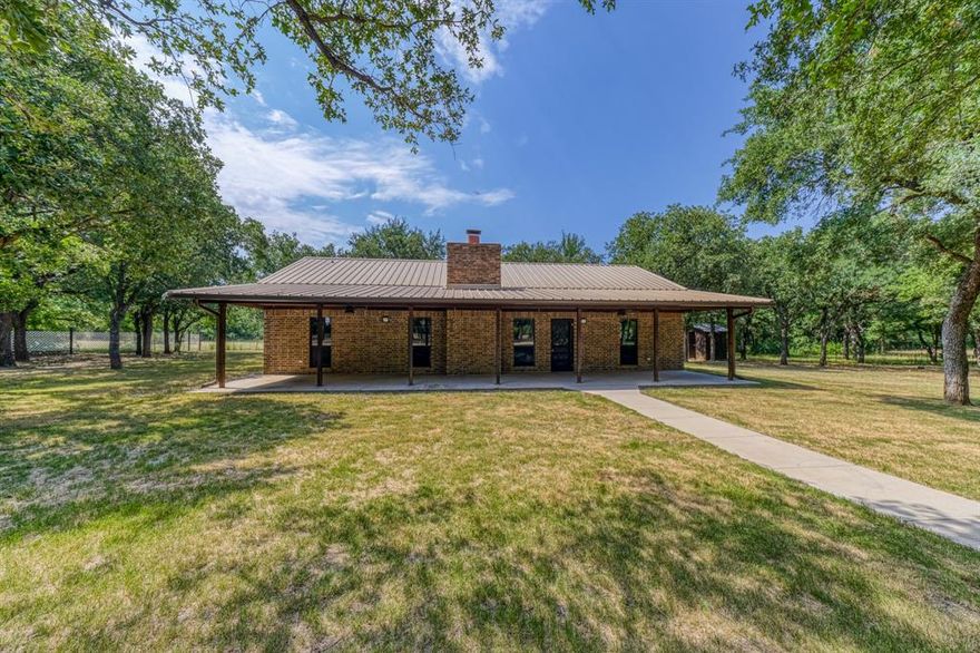 **Multiple offer situation, please submit highest and best by Tuesday, June 27th 5pm.*** Welcome to country living on 6 acres in Parker County. This BEAUTIFUL ranch style house surrounded by towering shade trees sits off the road with a gated entrance and circle driveway. Huge front porch to enjoy the serenity. The home features a metal roof, 3 large bedrooms, 2 full bathrooms, huge family room with brick fireplace, spacious utility room, brand new wood-look tile flooring throughout, new daylight bulbs to brighten every room, clean, and ready for new owners! Sprinkler system, exterior shed, nice divided fence in the back, and gate opening to the adjoining pasture for a total of 6 acres here in the wonderful Millsap ISD. This FANTASTIC property near the schools is a MUST-SEE! **Owner is selling the property “as is with no repairs “** ***Buyers will be responsible for a new survey if needed.****Measurements are approximates, buyers and agents to verify exact measurements*