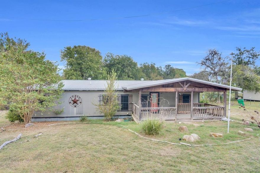 Tucked away on a quiet stretch of Saralvo Road, this charming three-bed, two-bath home sits on just under an acre of open Texas land.

Inside, the home blends cozy farmhouse warmth with a modern edge. The living area feels open and relaxed with exposed wood beams and a corrugated metal ceiling that adds personality and texture. The kitchen is built for both everyday living and entertaining, featuring stainless appliances, double ovens, and plenty of counter space to cook and gather.

The primary suite offers a peaceful escape with a large soaking tub, dual sinks, and stone accents that give it a spa-like feel. Each room in the home has its own inviting character, while the layout keeps everything connected and easy to enjoy.

Step outside and you’ll find space to spread out — perfect for kids, pets, or a future garden. Whether you’re looking for a weekend getaway or a place to settle down with some breathing room, this property captures that laid-back Texas lifestyle without being too far from town.