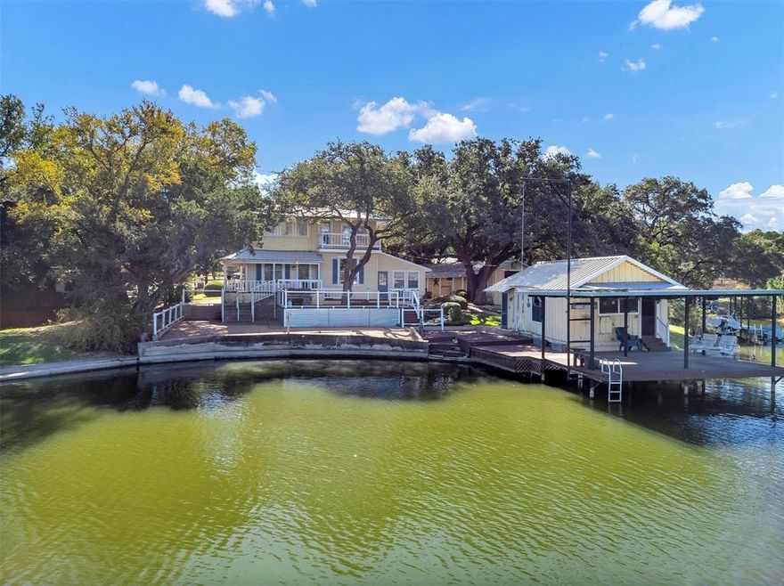 CURRENT APPRAISAL IN HAND FOR OVER THE ASKING PRICE. Welcome to lakeside living with serious VYBE. This remodeled lakefront retreat sits on roughly 350 feet of deep, wide waterfront with a private boat dock, boathouse, and plenty of outdoor hangout space made for sunrise coffee or sunset cocktails. The main home features 2 bedrooms, 2 baths, and a remodeled guest house, perfect for family, friends, or a short-term rental since it’s STR-approved. Inside, everything has been thoughtfully updated with new AC units, new kitchen plumbing, and modern touches throughout that keep the lakehouse charm alive. Step outside and you’ll find plenty of storage, a chicken coop, and outdoor areas designed for laid-back Texas living.

With an appraisal already in hand for higher than the asking price, plus rate buy-down or closing cost incentives offered, this one delivers both lifestyle and value. Whether you’re looking for a full-time lake escape or an income-generating getaway, 3814 Pawnee Ct brings the best of Granbury waterfront living with wide water, good energy, and that unmistakable VYBE.