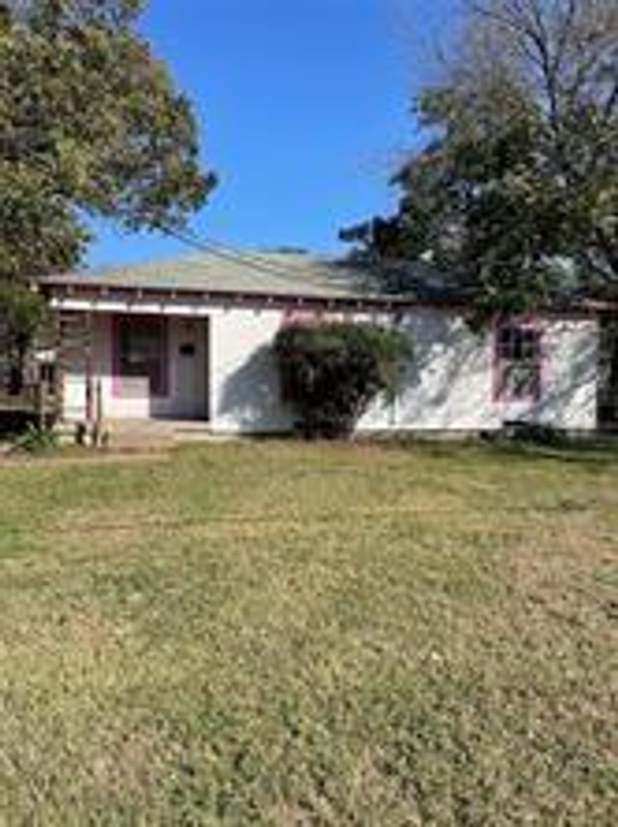 Two bedroom, one bathroom home on almost a quarter acre. Home is in sturdy condition with hardwood flooring throughout most of the house. Has gas hook ups for the stove and water heater. Water heater is less than 10 years old. Home has a window unit. Property features a detached garage in the back of the house with small office or workshop area on a beautiful, oversized lot. Small remodeling and this home could be something special.