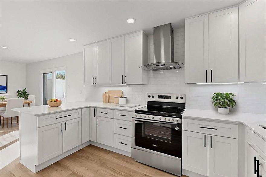 What an AMAZING FIND at an AMAZING VALUE! This 1st floor, 3 bedroom STUNNER is sure to wow you with its beautiful open floor plan and tons of upgrades! Kitchen includes gorgeous custom cabinetry with soft close drawers, lazy susan, vent a hood, under cabinet lighting and glass niche for an extra touch of class! Lovely granite countertops and subway tile backsplash, undermount sink with LED Faucet, breakfast bar, all stainless appliances with refrigerator included! Living area is nice and spacious with ceiling fan that leads out to your own fenced in private patio! Home has designer luxury vinyl tile flooring throughout, recessed lighting, 2 inch faux wood blinds and  hardwired smoke detectors!! All 3 bedrooms are spacious with nice sized walk in closets and ceiling fans! There is also a storage closet in the hallway to boot! Both baths have very stylish vanities, LED Mirror with Touch Sensor, stainless hardware and elegant tile!! Location is absolutely fantastic! Condo is minutes from 635, hwy 75, galleria mall and tons of awesome dining, shopping and entertainment. Water is included in the Hoa dues!