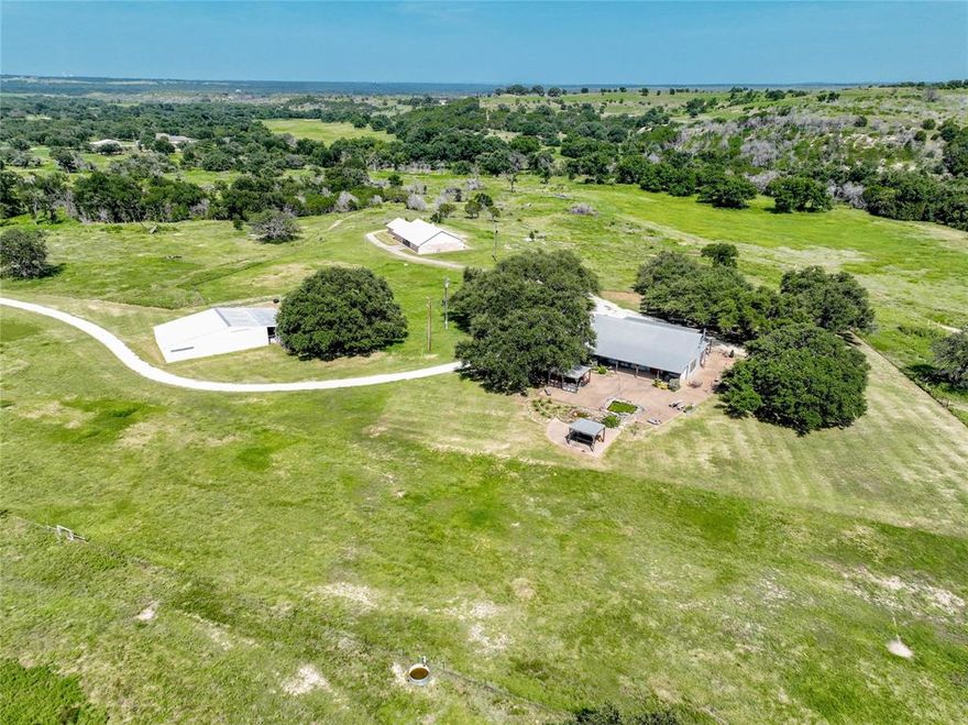 Over 242 acres in North Central Texas. Circle Eight Ranch, a fourth-generation ranch that began as a dude ranch! Centrally located close to historic Glen Rose -10 miles-and Granbury -18 miles-, only -85 miles to Dallas , 63 miles-to Fort Worth, and Austin is 160 miles- Located along FM 205 with .6 miles of paved road frontage. Rough Creek cuts the property nearly in half, as well as three big hills with elevation variations of more than 100 feet. Completely fenced on all 4 sides with 5 strand barb wire. The agricultural portion is cross-fenced with acreage currently planted in proprietary wildlife grass-wheat mix. 3 - tanks, 2-water wells, water lines to three water troughs, working barn -storage-tack room, attached equipment storage, pens and livestock shoot. FLY IN ON THE 2100 X 30 FOOT FAA REGISTERED RUNWAY -XA04- grass runway is fully fenced with poured slab for future hanger. Huge old oaks, pecans, deer and turkey. Main house, 2,600 sqft open concept, 3-3-3, fire place, covered porches, brick with steel roof. Guest house 2,100 sqft, large open concept, 1-2 with large sleeping loft, wood burning stove, hardy board with steel roof, outdoor kitchen, over 6,000sqft covered carports, porches and patios.  PERFECT LOCATION FOR PRIVATE FLY IN RANCH, WEEKEND RETREAT, WORKING CATTLE OR HORSE FARM, BED AND BREAKFAST, DUDE RANCH, CORPORATE RETREAT, WILDLIFE MANAGMENT- POSSIBLITIES ENDLESS! .