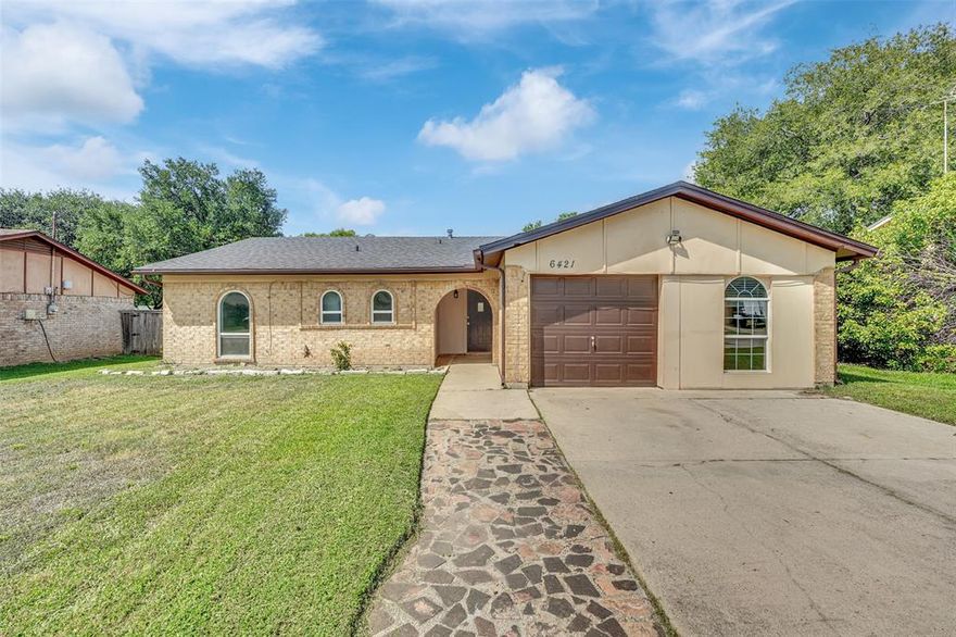 Welcome to 6421 Perdido Dr in Watauga, a charming single-story ranch-style home with Mediterranean-inspired arches offering timeless curb appeal and modern updates. This 4-bedroom, 2-bath residence features a bright and inviting layout with a cozy living area, spacious kitchen, and well-sized bedrooms designed for comfort and functionality. Recent improvements include a new roof and updated windows, giving peace of mind for years to come. The attached garage and extended driveway provide convenient parking, while the large backyard offers endless potential for outdoor living, entertaining, or gardening. Nestled in a quiet neighborhood with mature trees, the home is just minutes from shopping, dining, schools, and major highways, ensuring easy access to all that Watauga and the greater Fort Worth area have to offer!