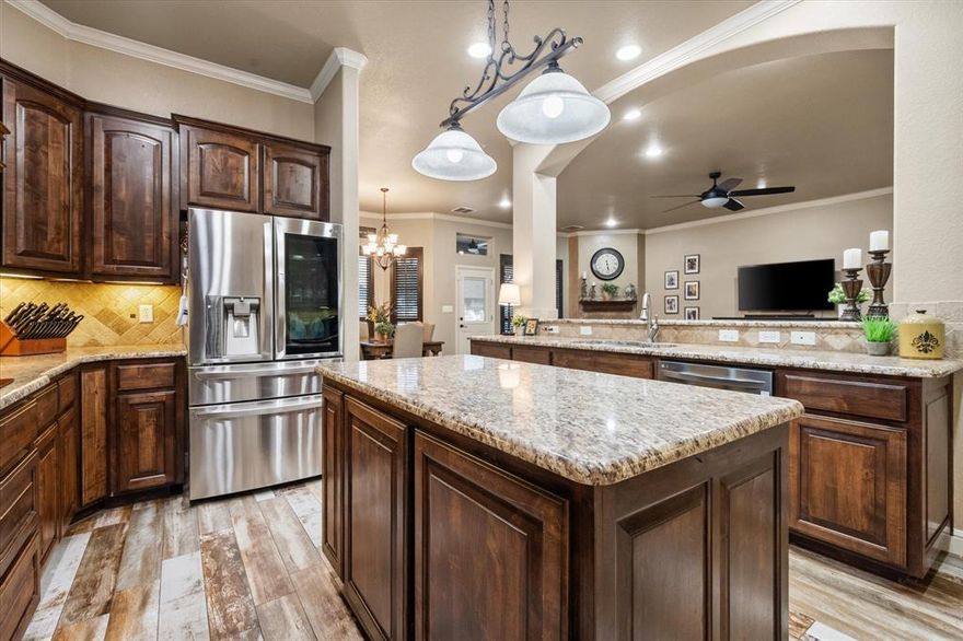 JUST REDUCED on .89 acres in the highly sought-after upscale gated community of De Cordova Ranch on Lake Granbury, TX, in Hood County. Very well-maintained! LET’S GO…all brick and stone exterior, 2,725 sq ft, four bedrooms, two and a half baths, both breakfast dining and a formal dining area, no carpet throughout, upgraded granite countertops, custom cabinetry, custom plantation shutters, large kitchen with an island that will accommodate the whole family cooking together. Large living room with a gas log fireplace. Coffered ceilings in the primary bedroom. Nice-sized laundry room conveniently located just off the primary bathroom, which has a jetted tub, separate shower, separate vanities, and a large walk-in closet. Ample storage throughout the home. Luxurious gunite swimming pool with a Dolphin Robotic Pool Cleaner, diving board, water slide, and a LARGE SPA big enough to accommodate 10 plus people, to be enjoyed all year round with its ability to independently heat. MULTIPLE outdoor seating areas for your pool furniture, play set, and a covered living area to watch your favorite sports and movies. Stainless steel Zephyr buffet cabinet system with a mini refrigerator to keep your favorite beverages and snacks easily accessible and cold! Exterior is already plumbed for gas. Nicely manicured and landscaped with black pipe fencing, irrigation in the front, sides, and backyard. Side-facing 3-car garage with ample parking. No big steps or stairs on the property; all single-level except inside the pool and spa, of course :) Located just minutes from Downtown Granbury, which offers boutique shopping, unique restaurants, and live music entertainment—very near fishing, boating, swimming, and golfing. NO THROUGH TRAFFIC makes this property peaceful.  Do not use GPS. You must access this fine gated community off of Davis Rd. The address to the main entrance is 3602 De Cordova Ranch Rd, Granbury. New roof as of last year. One new HVAC.