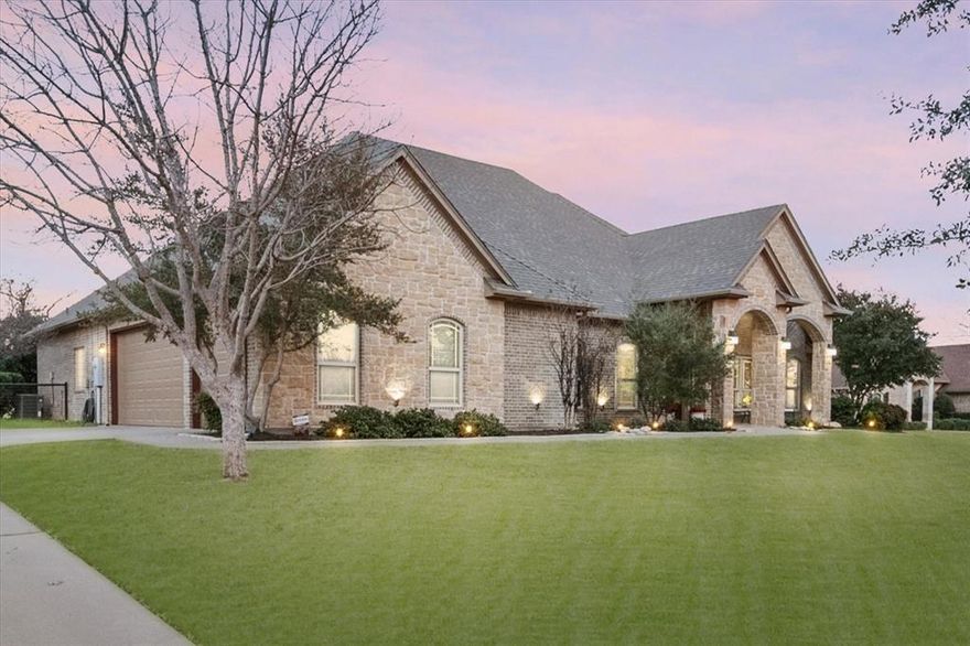 Located on .89 acres in the highly sought-after upscale gated community of De Cordova Ranch on Lake Granbury, TX. Very well-maintained home that has it all! LET’S GO…all brick and stone exterior, 2,725 sq ft, four bedrooms, two and a half baths, both breakfast dining and a formal dining area, no carpet throughout, upgraded granite countertops, custom cabinetry,  custom plantation shutters, large kitchen with an island that will accommodate the whole family cooking together with the adjoining living room that has a gas log fireplace. Coffered ceilings in the primary bedroom. A large laundry room is conveniently located just off the primary bathroom, which has a jetted tub, separate shower, separate vanities, a large walk-in closet, cabinets, and ample storage throughout the home. Luxurious pool with a Dolphin Robotic Pool Cleaner that includes a diving board, slide, and a LARGE SPA big enough to accommodate 10 plus people, to be enjoyed all year round with its ability to independently heat.  MULTIPLE outdoor seating areas for your pool furniture, and a covered living area to watch your favorite sports and movies.  Stainless steel Zephyr buffet cabinet system with a mini refrigerator to keep your favorite beverages and snacks easily accessible and cold!  Exterior is already plumbed for gas. Nicely manicured and landscaped with black pipe fencing, irrigation in the front, sides, and backyard. Side-facing 3-car garage with ample parking. New HVAC, and water heater. The roof was replaced last year. No big steps or stairs on the property; all single-level except inside the pool and spa, of course :) Located just minutes from Downtown Granbury, which offers boutique shopping, unique restaurants, and live music entertainment. Very near fishing, boating, swiming and golfing. NO THROUGH TRAFFIC makes this property peaceful.  Do not use GPS. You must access this fine gated community off of Davis Rd. The address for the main entrance is 3602 De Cordova Ranch Rd, Granbury, TX.