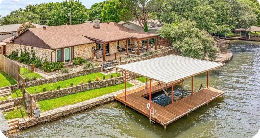 Beautiful WATERFRONT property currently being used as a weekend family home and as a 5 Star ncome property with Airbnb. Minutes from Town Square and shopping.  Property features a large 2 car garage, dock, watercraft lift, tons of built ins and walk in closet space