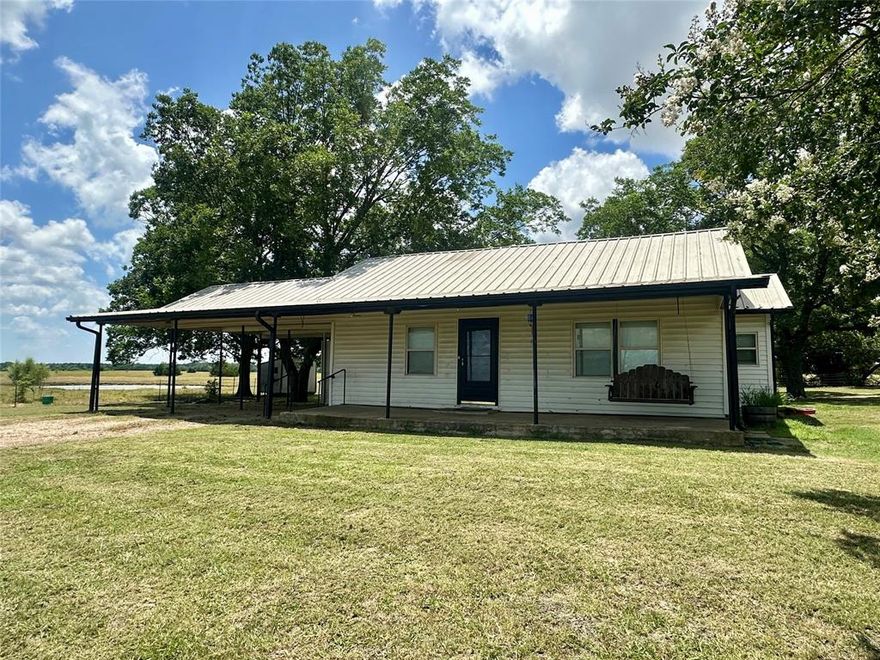 Charming farmhouse on 6 peaceful acres in desirable Chisum ISD! This 2-bedroom, 1-bath home offers a cozy and functional layout with separate living and dining rooms—ideal for relaxing or entertaining. Enjoy country sunsets from the covered front porch or stay shaded year-round under the attached two-car carport. With plenty of open space, this property is perfect for a horse or show animals, offering the freedom and flexibility of rural living while staying close to town. A rare opportunity for country charm and room to grow—don’t miss it!