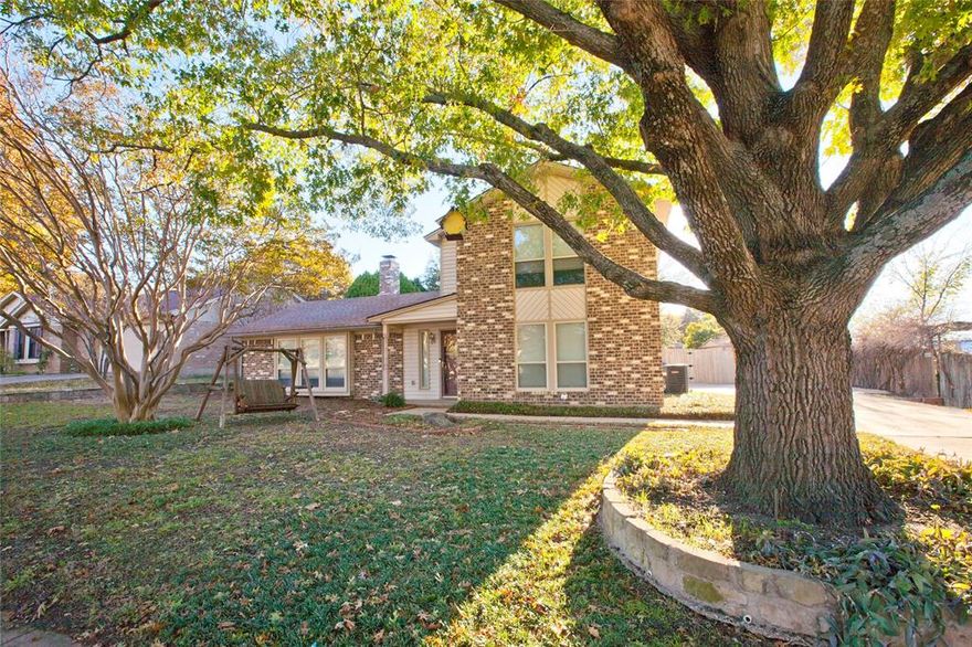 Let Lightness and brightness be yours in this traditional home nestled in a well established neighborhood. Located in the coveted Westpark Addition in Benbrook this inviting 3-bed, 2-bath charmer is move-in ready & just blocks from away from the Middle-High School & Elementary school, which all earn high marks. The City of Benbrook shows positive ratings for 2025, such as the Scenic City recertification, also noted for it's small-town feel near Fort Worth. Step inside and you’re greeted by an open, airy living room anchored by a cozy wood-burning fireplace with custom Arizona Cypress live-edge mantle, ideal for relaxing evenings or hosting friends. Sunlight pours through the front of the home via the expansive three-windows with classic window seat, creating a cheerful space filled with natural light. Updated HVAC (2023), engineered wood flooring, fresh paint, and thoughtful touches bring renewed life to this 1977-built gem. The efficient kitchen is a delight to work in with quartz counters, stainless steel & black appliances, a modern touch with the large stainless steel apron front sink, and excellent built-in cabinet storage. The primary bedroom conveniently sits downstairs, offering privacy & comfort, while two additional bedrooms upstairs share a full bathroom—perfect for family, guests, or flexible use. Outside, the magic continues. The relaxing backyard oasis features a mature oak tree, large covered patio, spacious stone patio with fire pit, and large flowerbeds anchored by mature shade trees. Two storage buildings provide extra room for tools, lawn equipment, and seasonal décor. The side driveway adds easy parking and convenient access for both homeowners and visitors. Located just moments from, major roadways and highways, everyday shopping, and popular dining spots, this home combines lifestyle, location, and comfort in one irresistible package. Discover the warmth, the light, and the charm of Westpark living—your next chapter begins at 10029 Westpark Dr.