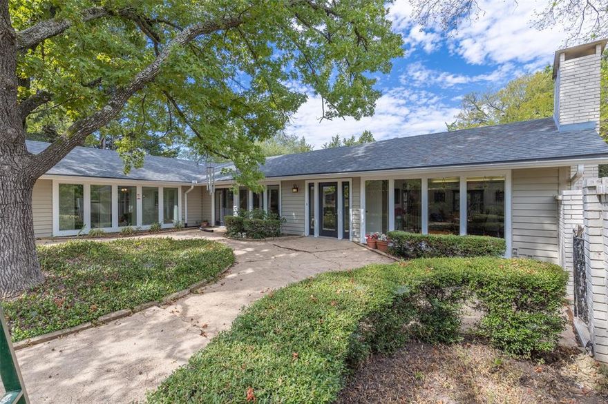 You just don't see this type of home everyday! Three bedroom two bath home sitting on almost 5 acres with huge pecan trees everywhere.  Large windows overlooking a beautiful courtyard with so many possibilities.  Vaulted ceilings, large living and dining area.  Beautiful wood burning fireplace surrounded by white brick. This home has been very well maintained with beautiful wood and ceramic tile flooring, new roof 2 years ago, new HVAC 6 months ago and new gutters.  Large room off the carport that would make a great mud room as it leads to the laundry room.  It could also be an office, craft room, or playroom for the kids. There is a shop with concrete floors, roll up door and electric. One side of the shop needs some work. Two separate store rooms in carport.