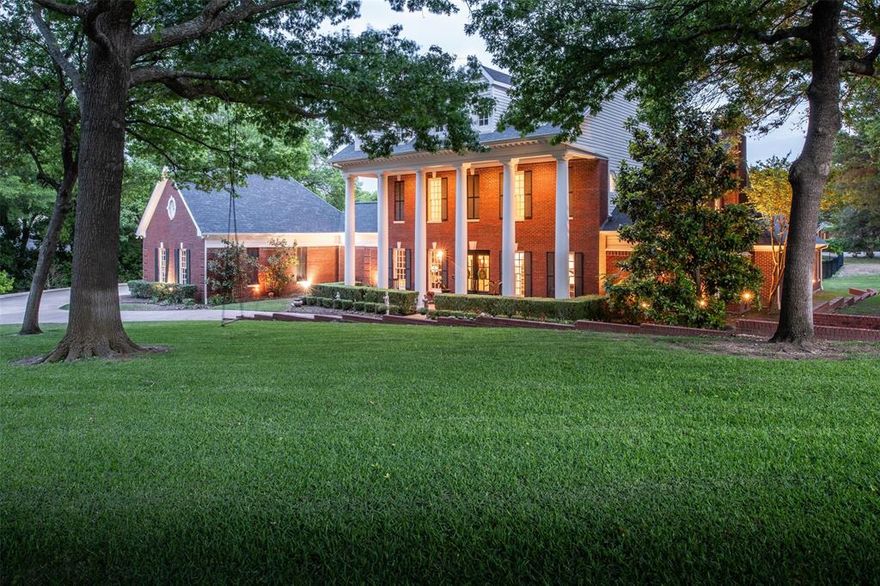 Traditional luxury describes this home best! Perched on the corner lot and framed by huge oak trees, this gorgeous and updated home features a welcoming layout with large spaces for entertaining a crowd or enjoying a quiet night.  Situated between the kitchen and the living room is a bonus built in bar space with multiple under cabinet refrigerators and shelves for display above.  Double doors open up to the covered patio and pool areas adding to the charm and ease.  The spacious primary bedroom on the first floor has windows that overlook the back and side of the property and a dual primary bathroom that include separate vanities with great storage space, double toilets and closets a jetted tub and large shower connecting the two sides.  The secondary bedroom downstairs is being used as a gameroom now with a beautiful fireplace, large bathroom and walk in closet. Upstairs, you'll find a media room, and 3 large bedrooms each with a connecting bathroom and large closets.