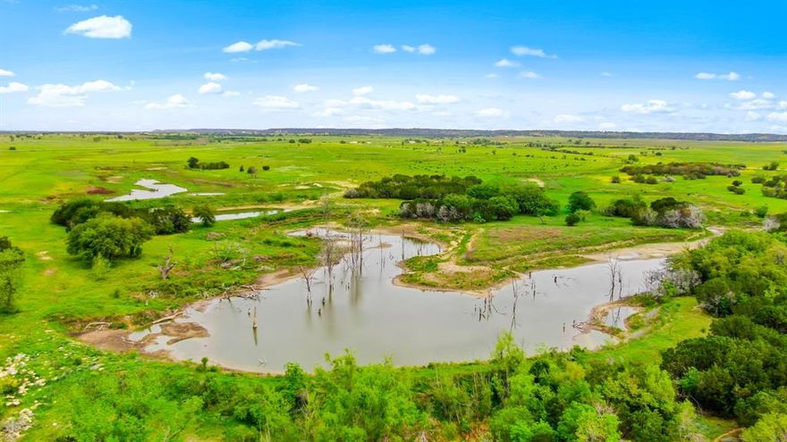 Welcome to your own private paradise! This stunning ranch, offers the perfect combination of cattle ranching and hunting opportunities. As you drive through the gates, you'll be greeted by breathtaking views of rolling hills and lush pastures, making it the ideal setting for your very own Texas ranch.  The property also boasts abundant wildlife, including whitetail deer, wild turkey, and feral hogs, making it a hunter's dream come true. The ranch is equipped with a wildlife feeder, as well as multiple ponds, providing excellent opportunities for fishing and waterfowl hunting. Located just a short drive from the charming town of Hico, Texas, this offers the perfect blend of seclusion and convenience. Whether you're looking for a place to call home or a weekend getaway, this 310-acre cattle and hunting ranch is truly a one-of-a-kind property that you won't want to miss.