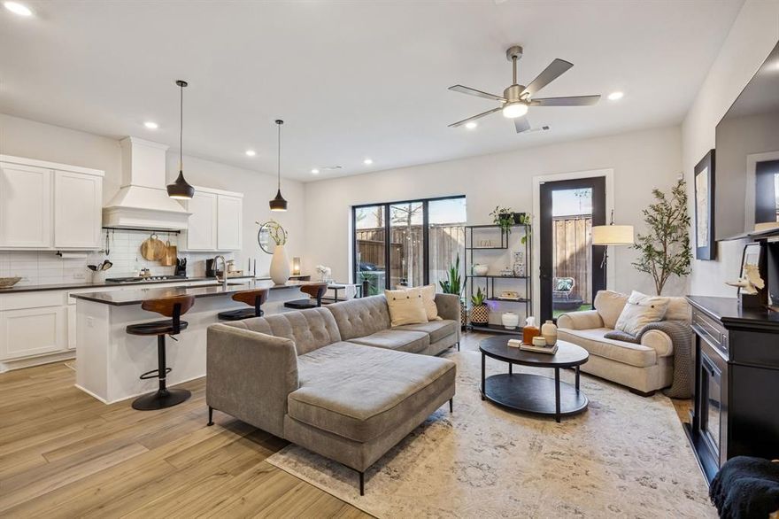 Assumable VA Loan at 3.3% - Modern 3 bedroom townhome near Downtown Dallas located at Fort Worth Avenue Townhomes near Stevens Park Village. Built in 2021 by Centre Living Homes, this 2,230 sq ft low-maintenance townhome with private backyard offers convenience, space, and easy commuting, complete with an attached two-car garage plus additional community guest parking. HOA maintains exterior insurance and can assist with backyard maintenance, making this a true lock-and-leave property.

The main level features an open living, dining, and kitchen layout with large island, quartz countertops, separate gas range and oven, abundant cabinetry, pantry storage, under-stair storage, powder bath, and luxury plank flooring. Ideal for buyers searching for an open concept Dallas townhome with modern finishes.

Upstairs includes a game room, two secondary bedrooms positioned at the front of the home for privacy, and a full bath with a separate vanity area so two people can get ready at once. Each bedroom has high ceilings for a townhome and multiple windows bringing in natural light. The primary suite offers quartz counters, a large shower with seat, linen storage, and generous closet space perfect for buyers looking for a 3 bedroom townhome with game room near Dallas.

Enjoy a rare townhome with private turf backyard, tall privacy fence, outdoor power, no front yard maintenance, plus access to a community dog park—ideal for buyers wanting a low-maintenance Dallas townhome with private yard.

Only 4 miles to Downtown Dallas, less than 1 mile to Interstate 30 for quick Dallas or Fort Worth commuting, 15 miles to Arlington Entertainment District, and 1 mile to Stevens Park Golf Course. Nearby conveniences include Sprouts, Aldi, 24-Hour Fitness, restaurants, Chipotle, and future Starbucks.

If you are searching for a modern townhome near Downtown Dallas with private yard, game room, guest parking, and low-maintenance living, this home is a must-see.