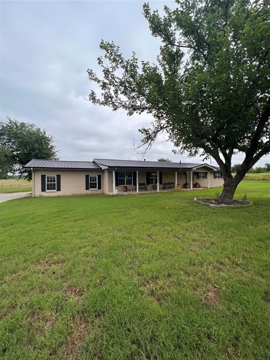 Beautiful updated home sitting atop 11.5 acres cross fenced for all your livestock needs.