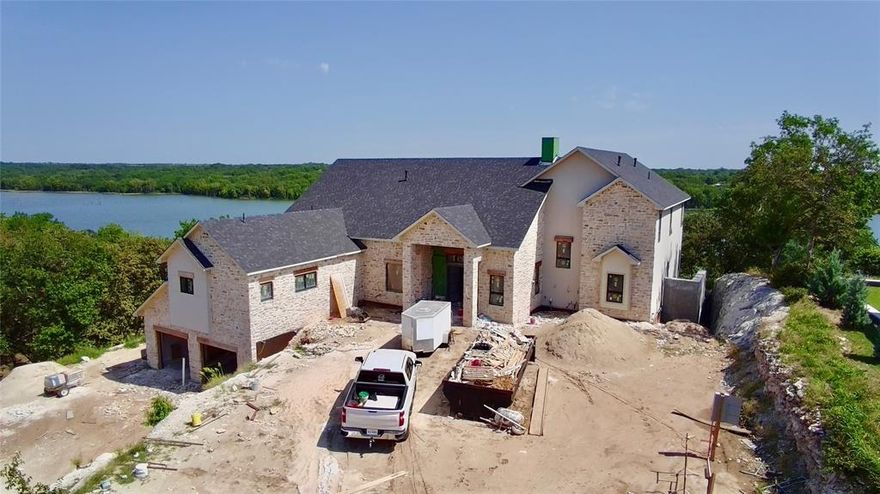 Elevated Lakefront Living – Moss Lake, Gainesville, TX

Poised on 4.38 premier waterfront acres, this luxury estate on Moss Lake is under construction and thoughtfully designed for upscale living. The three-story custom home will feature expansive balconies with breathtaking panoramic lake views, creating the perfect blend of indoor comfort and outdoor elegance. Including an additional separate garage with private living quarters attached to add flexibility for guests or extended stays. Enjoy a resort-style pool, hot tub, and a fully completed private boat dock.
